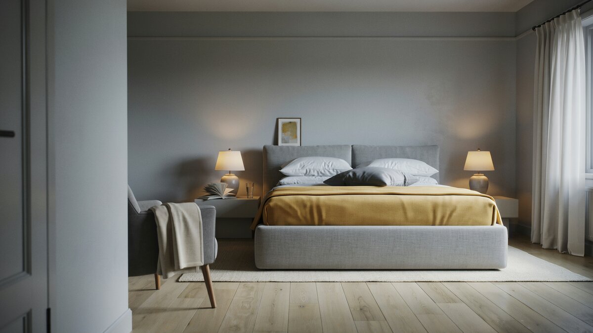 Golden yellow bed cover brightens a dim gray room with matching table lamps