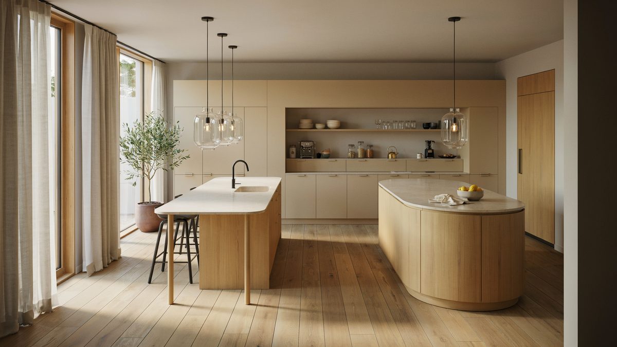 Straight pale wood island facing a curved island with rounded corner counters
