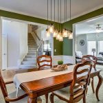 dining-room-with-bright-green-paint-and-white-wainscoting