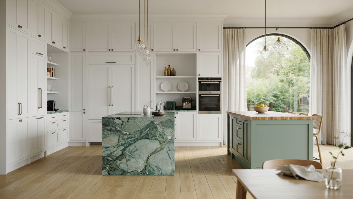 Green marble waterfall island beside a soft sage painted second island