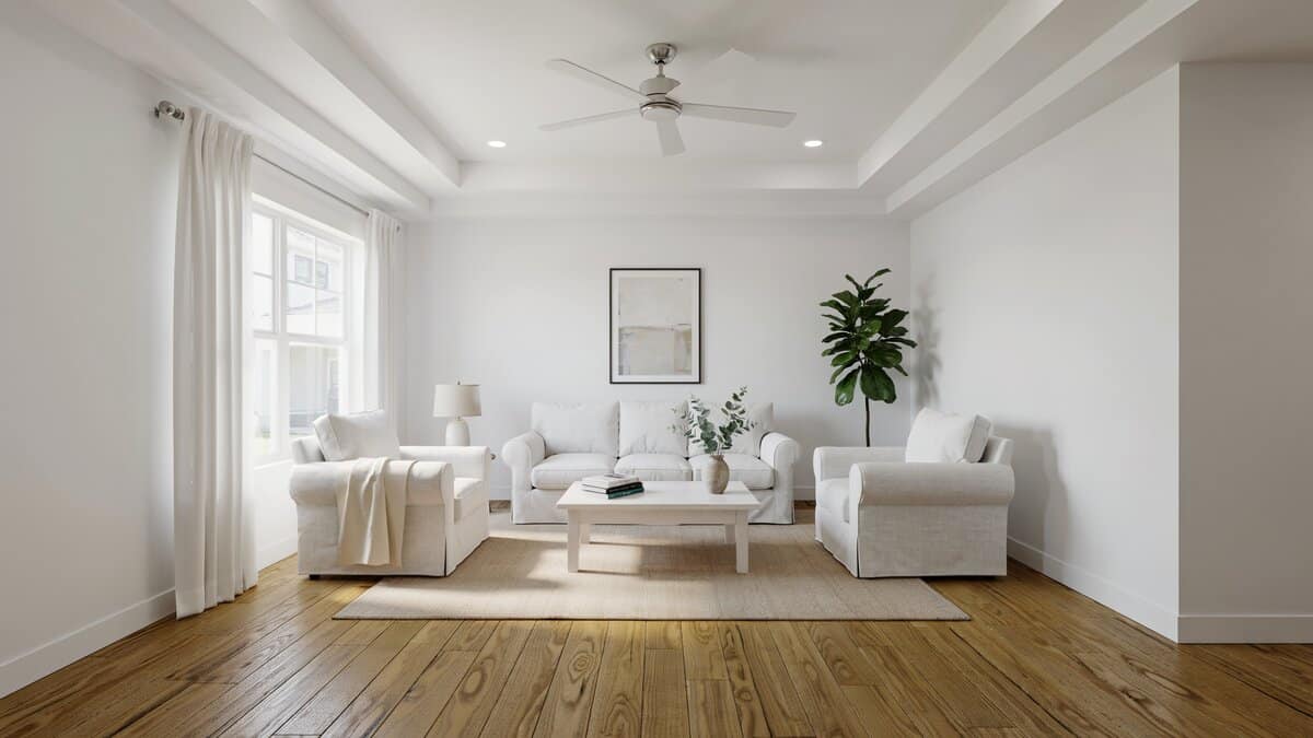 Living room with white furniture, hickory wood floors and high tray ceiling