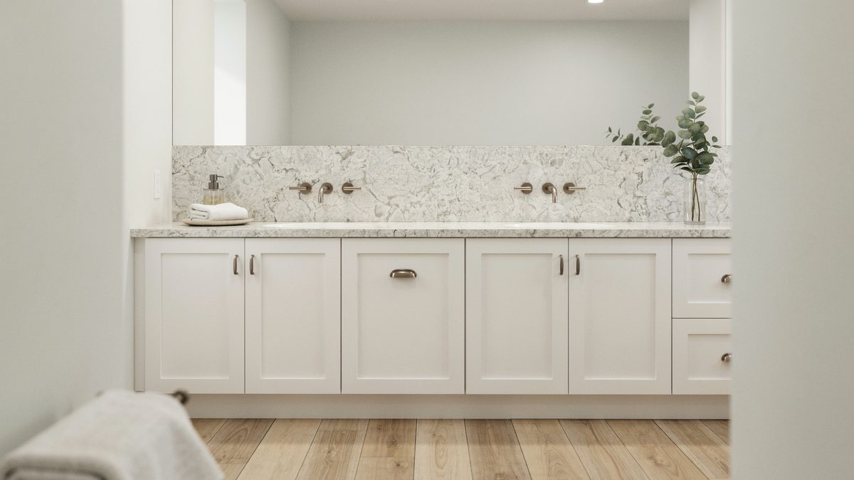 White shaker double vanity with speckled snowfall granite counter and matching backsplash