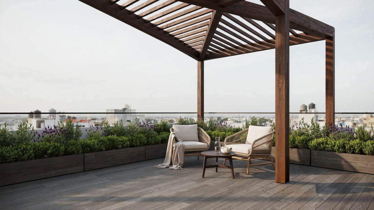 Angled dark wood pergola on a rooftop terrace with woven chairs and planters