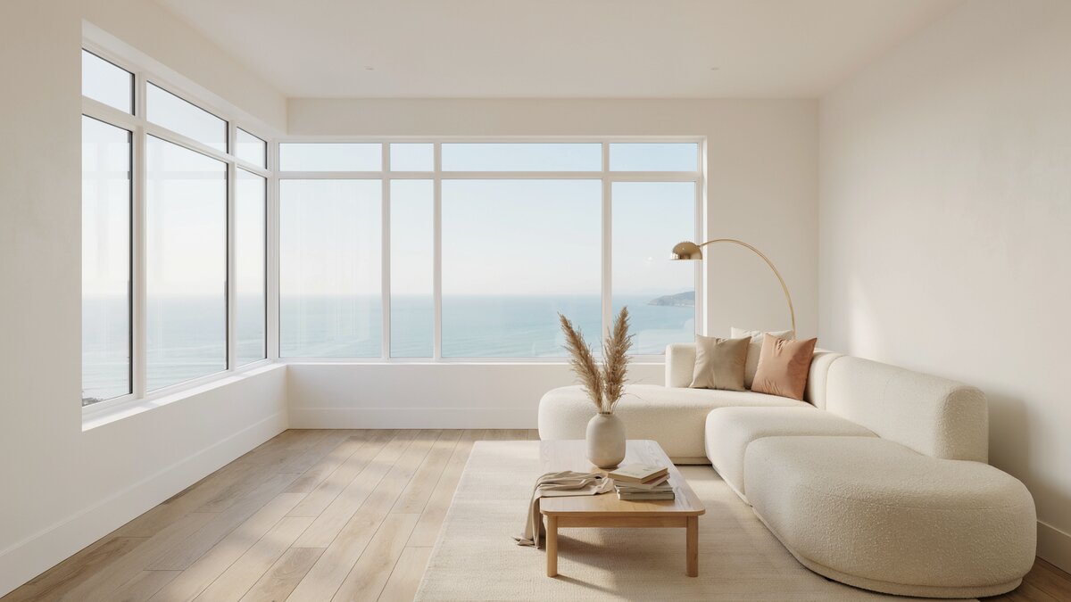 Modern white living room with expansive oceanfront view