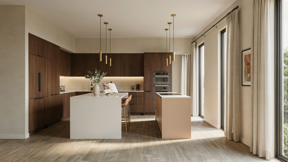 Walnut cabinetry behind two pale islands on wood look porcelain tile