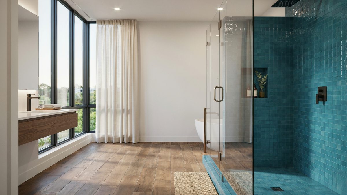 Teal tile shower and wood look plank floor in a bright modern bathroom
