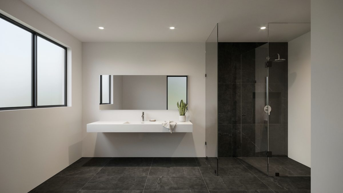 Black slate floor tile with a white floating vanity and walk in shower