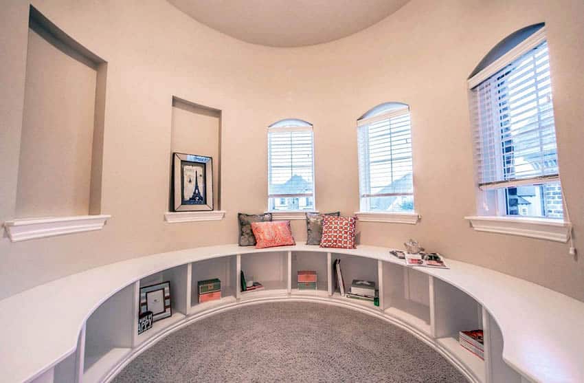 Circular window seat with under seat storage and wall alcoves