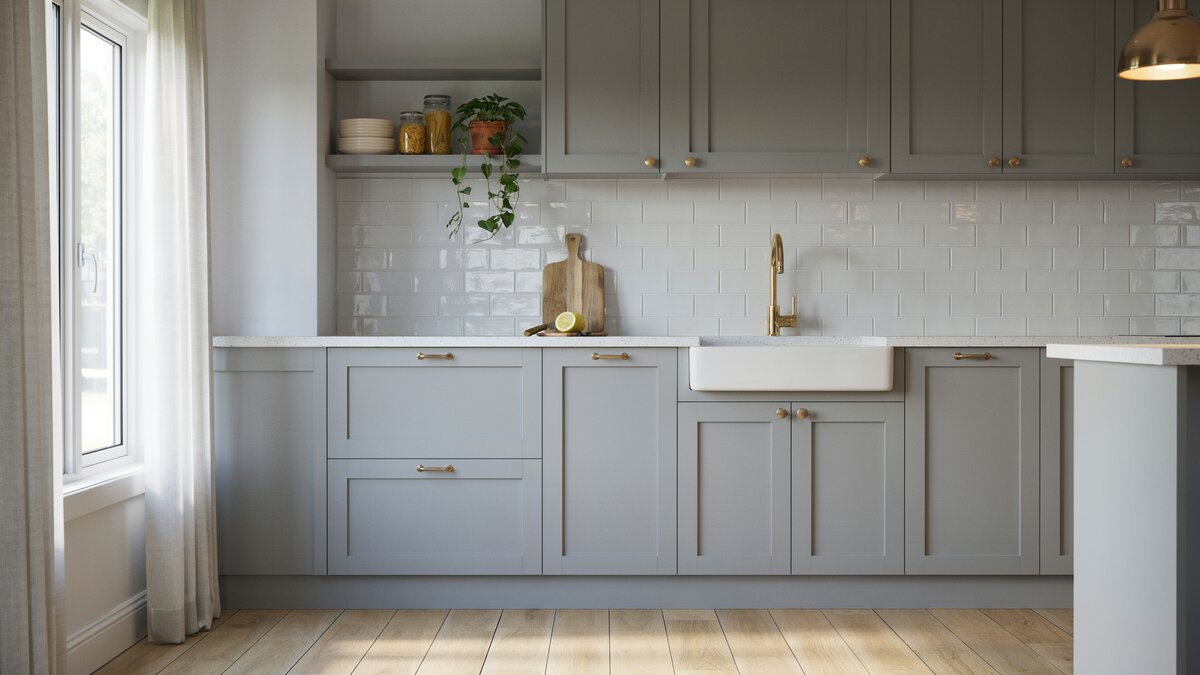 Gray shaker cabinets with gold gooseneck faucet and white farmhouse sink