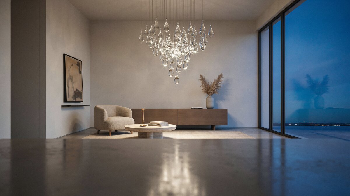 Glass droplet chandelier glittering above a couchless living room at blue dusk