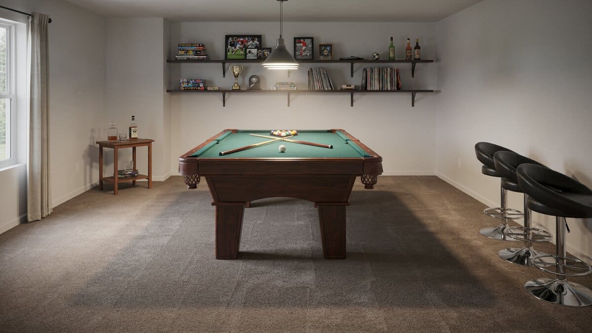 Brown wall to wall carpet in a game room with a pool table and stools