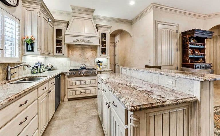 white kitchen cabinets with distressed white table