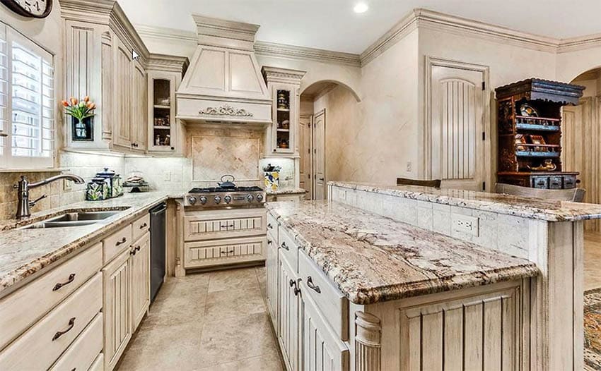 Kitchen that has antique glazed cabinets