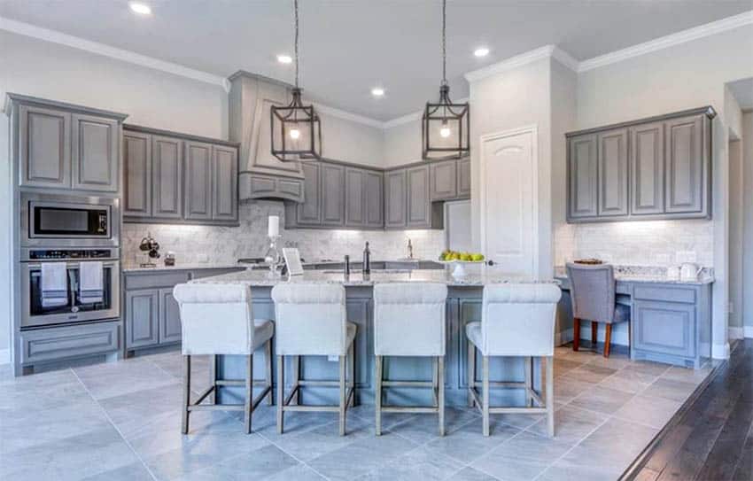 Kitchen with gray distressed paint cabinets and tile flooring