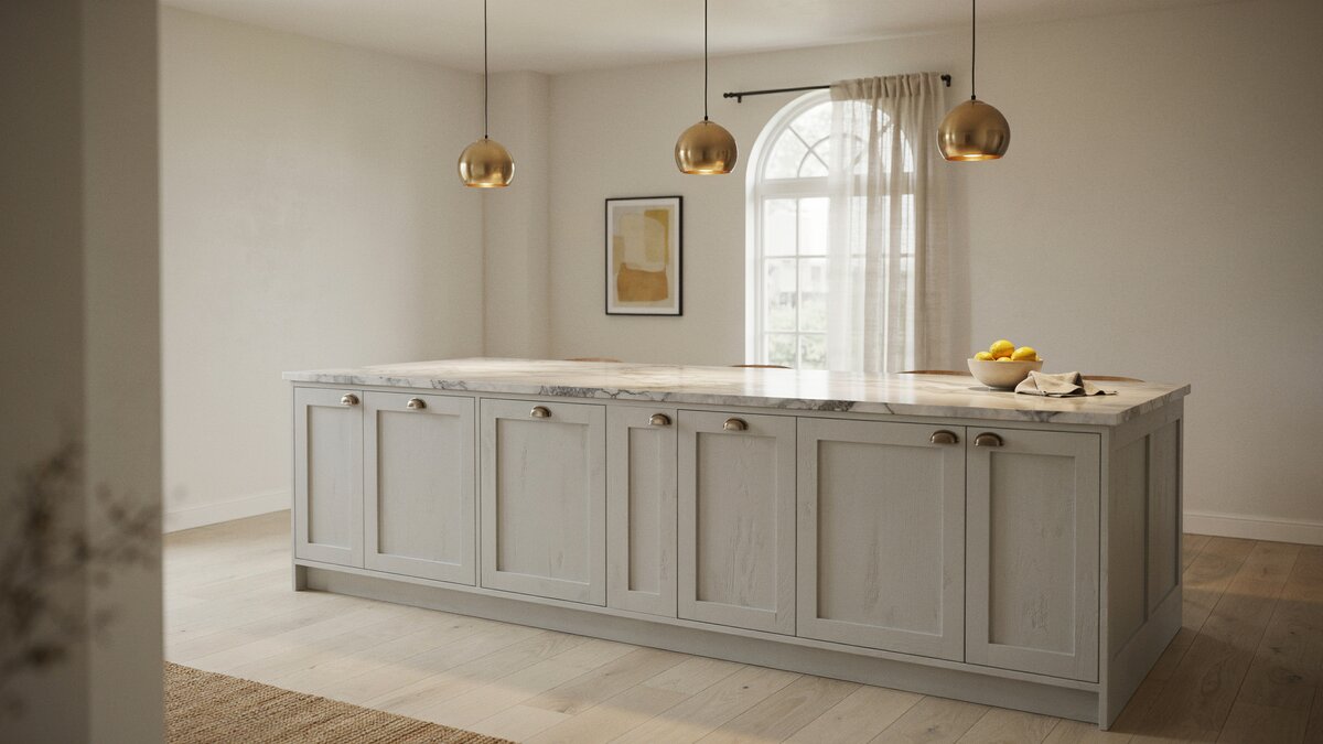 Long gray distressed island under gold globe pendants with Carrara marble top