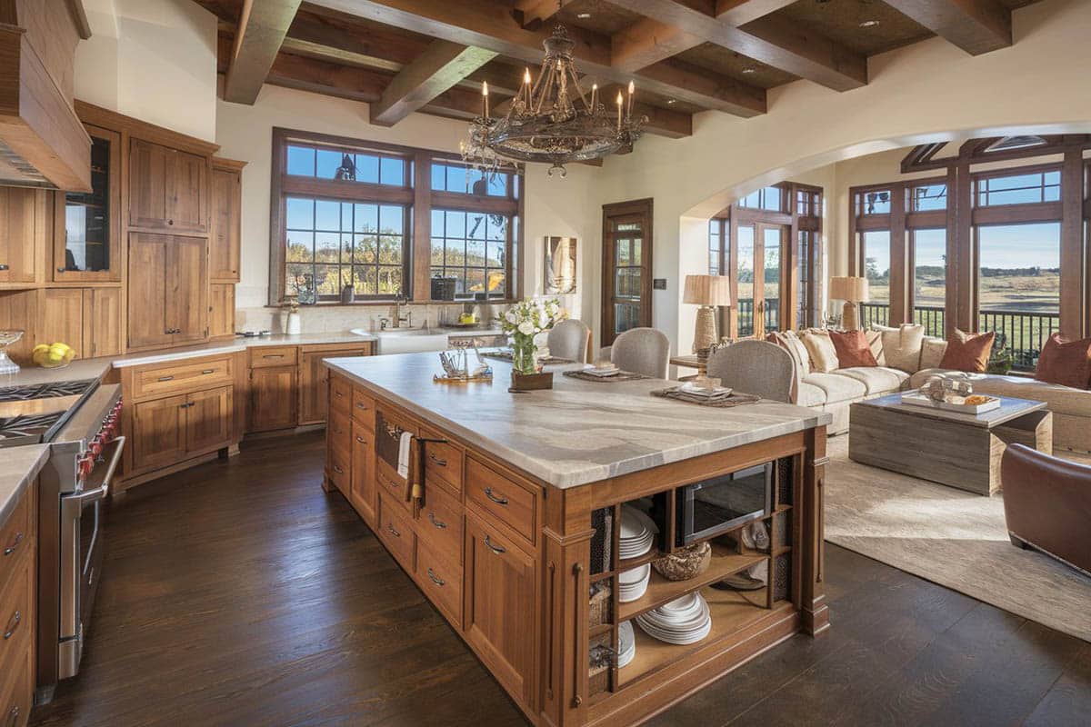 Craftsman kitchen with raised panel cabinets, white marble counters and wood floors