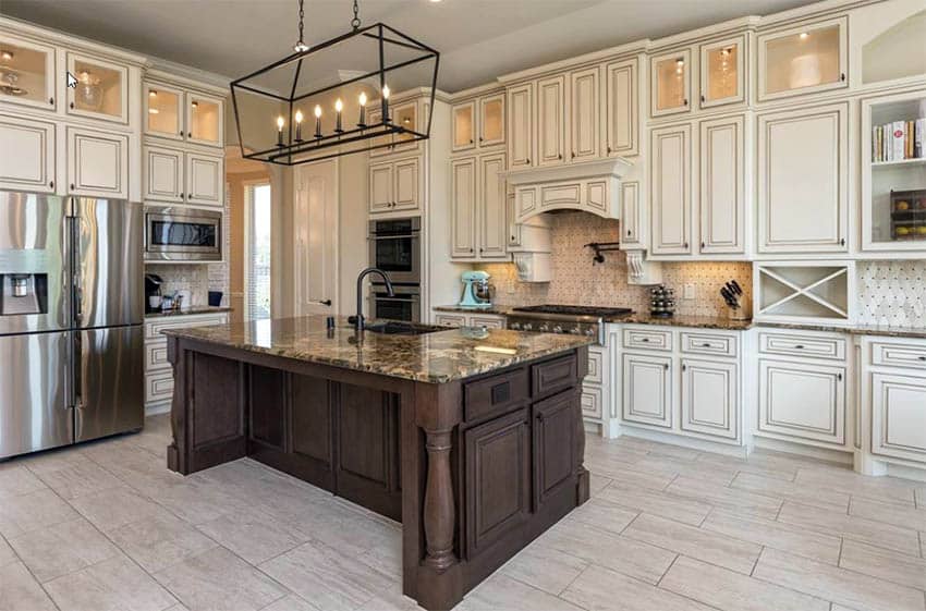 Luxury white glazed distressed maple cabinets and brown island with brown granite counters