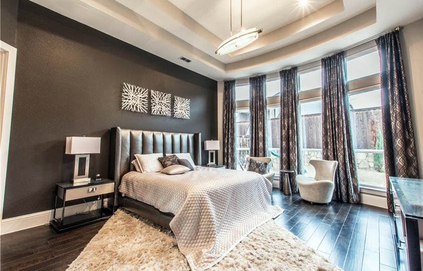 Bedroom with dark brown wall and large windows