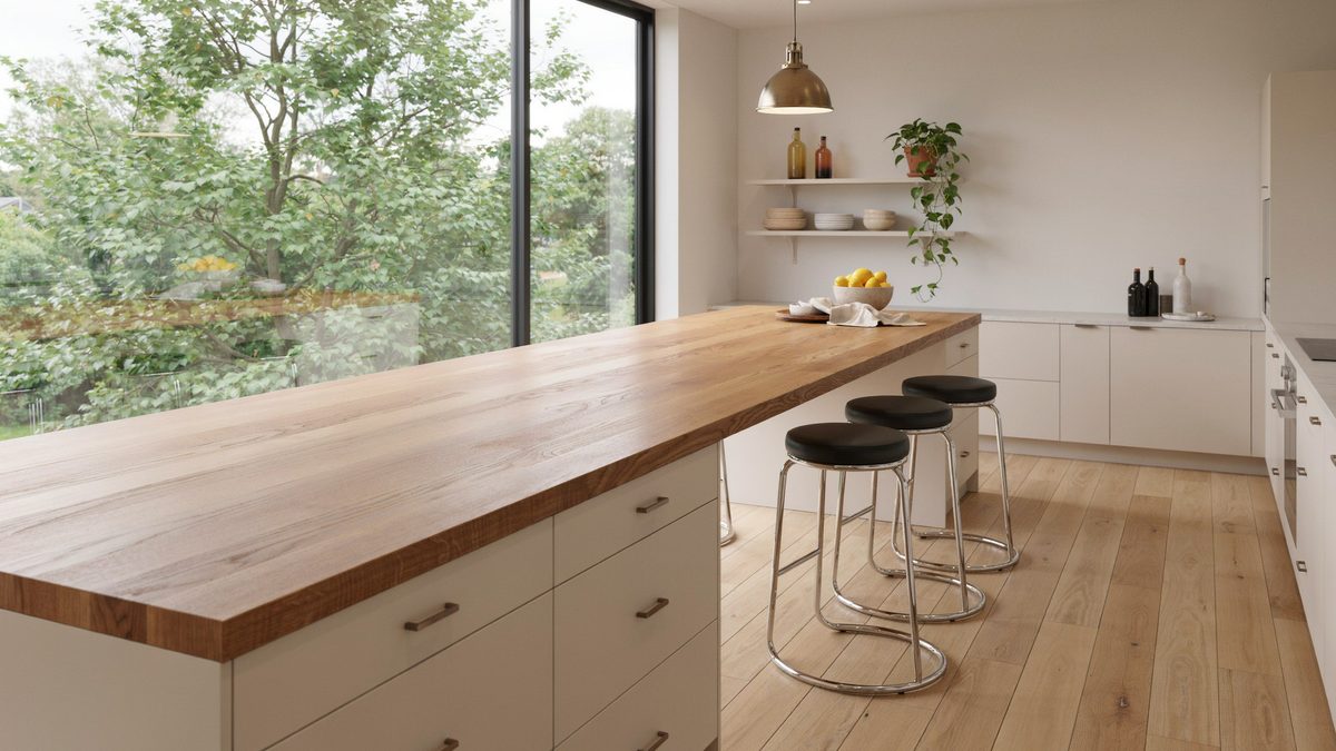 Thick wood counter with chrome backless stools facing a garden window