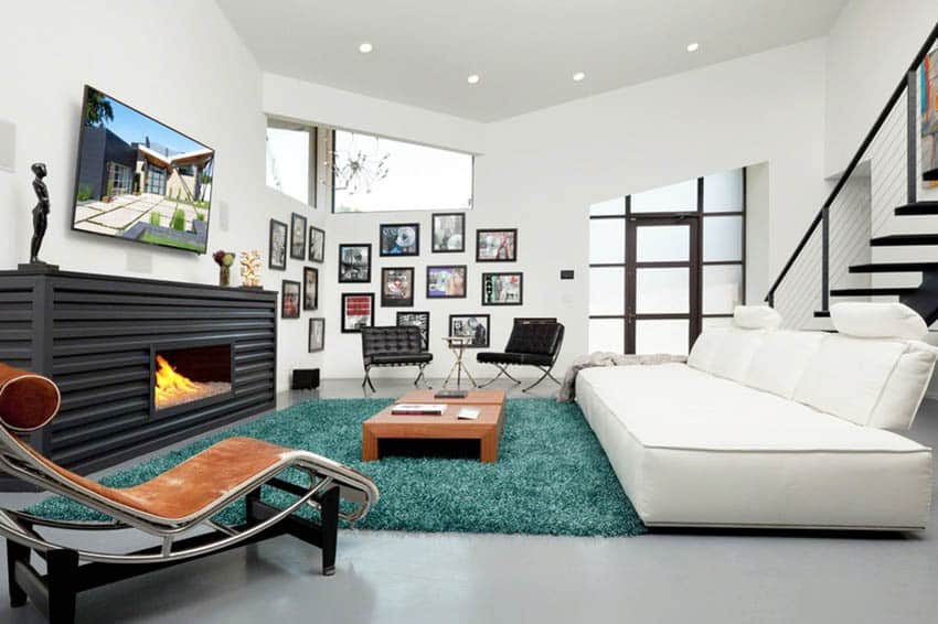 Living room with wooden lounge chair and sea green carpet