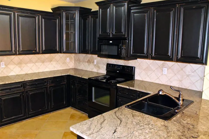 Traditional kitchen with black distressed cabinets