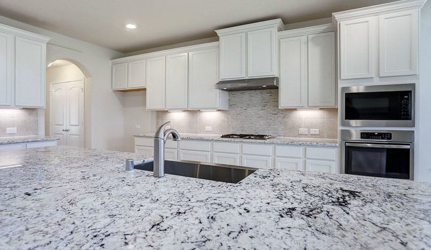 White Kitchen Cabinets With Granite Countertops   Traditional Kitchen With White Shaker Cabinets White Granite Countertops Large Island 