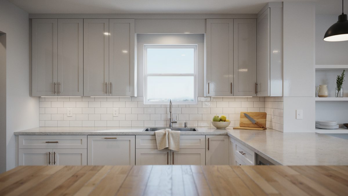 Gray acrylic cabinets with white subway tile and a butcher block counter