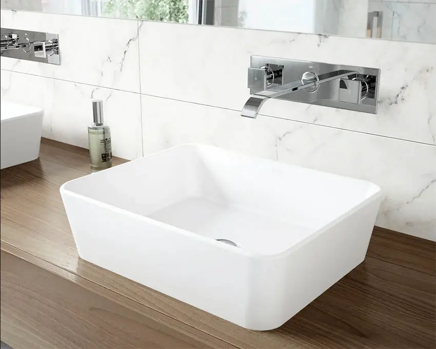 wall-mount-bathroom-faucet-with-marble-backsplash
