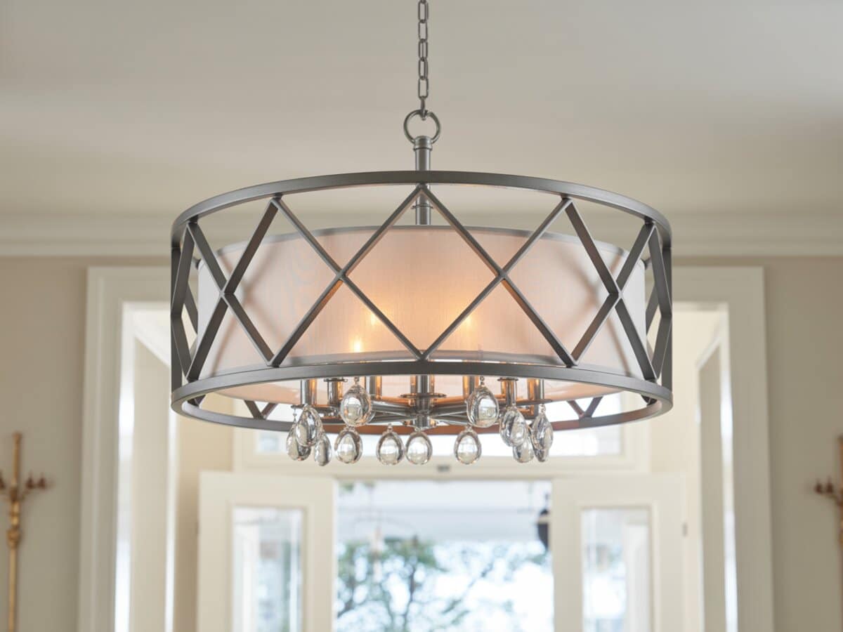 Gray diamond lattice drum chandelier with crystal drops in a bright entry hall