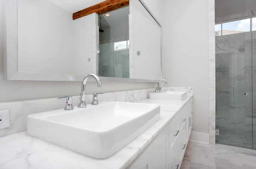 Bathroom with dual sink vanity and marble countertop