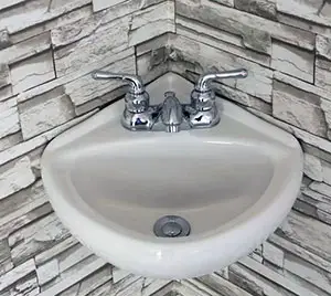 Corner wall mount sink