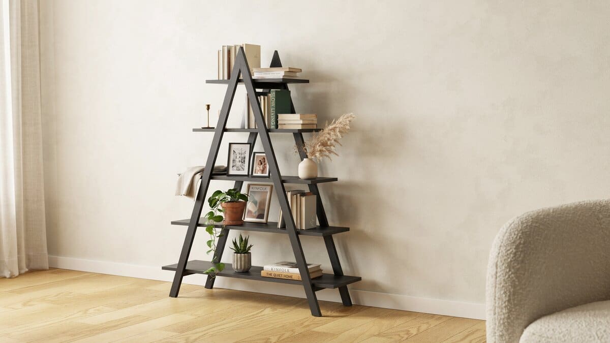Leaning ladder bookcase filled with books in a living room corner