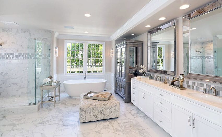 Luxury bathroom with dual undercounter sinks, marble shower and floors
