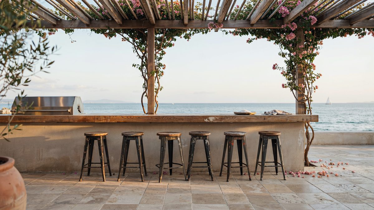 Walnut trellis bar and grill patio with antique iron stools and ocean view
