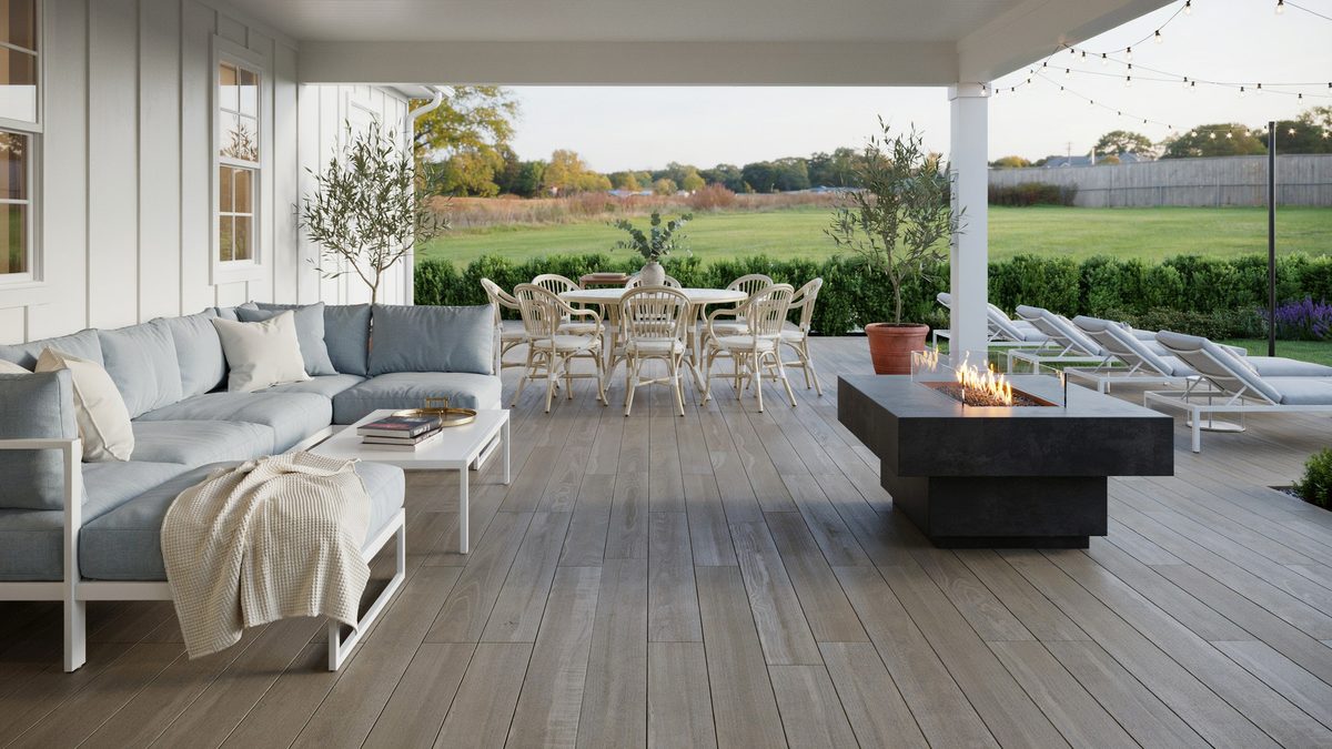 Spacious back porch with white rattan dining set and light blue cushioned chairs