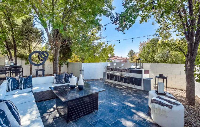 Backyard patio with slate floor tile and outdoor bar