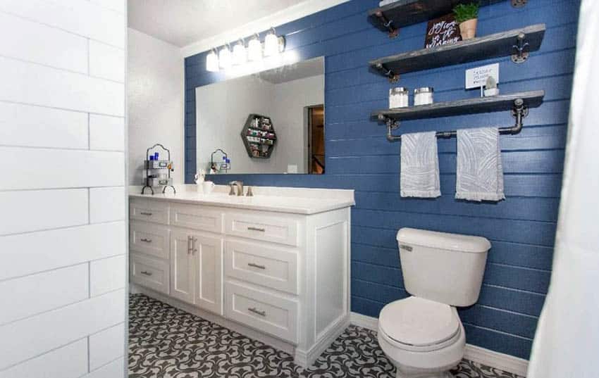 Bathroom with blue shiplap walls