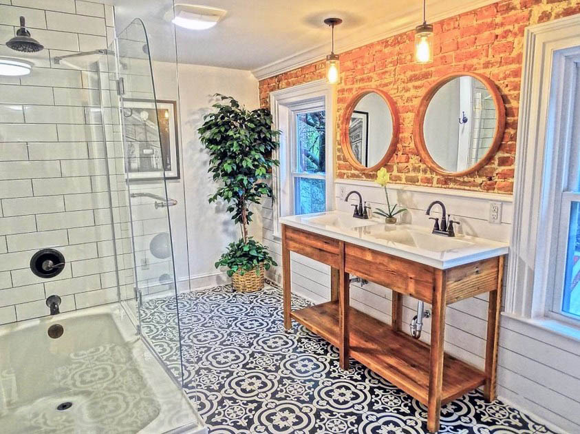 Bathroom with shiplap wainscoting and brick walls