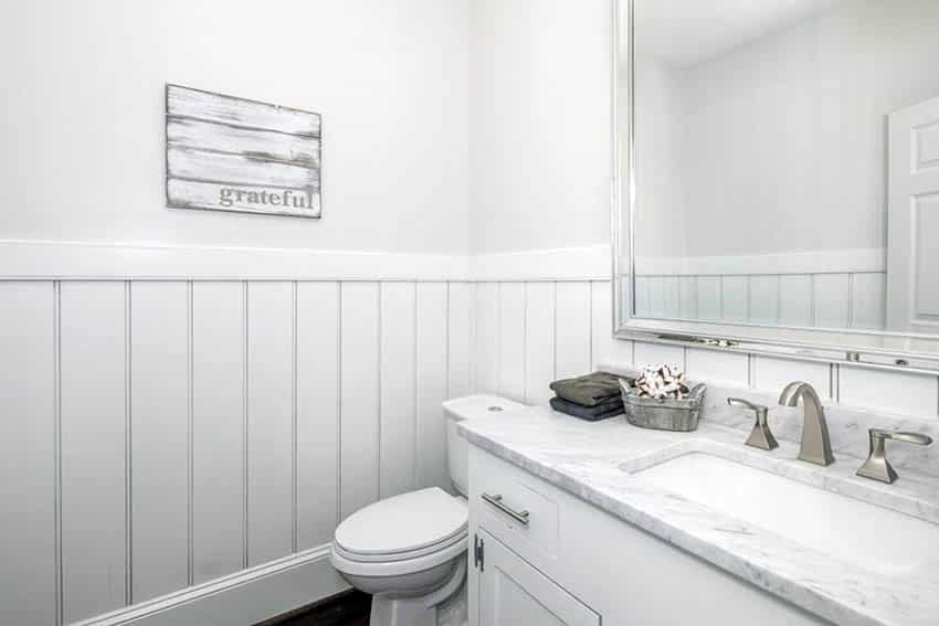 Small bathroom with white wood shiplap wainscoting