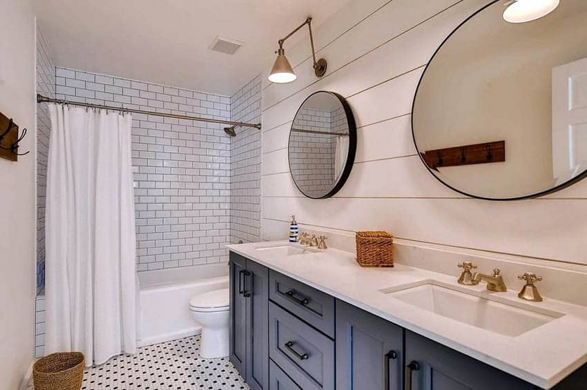 Bathroom with shiplap wall above dual sink vanity