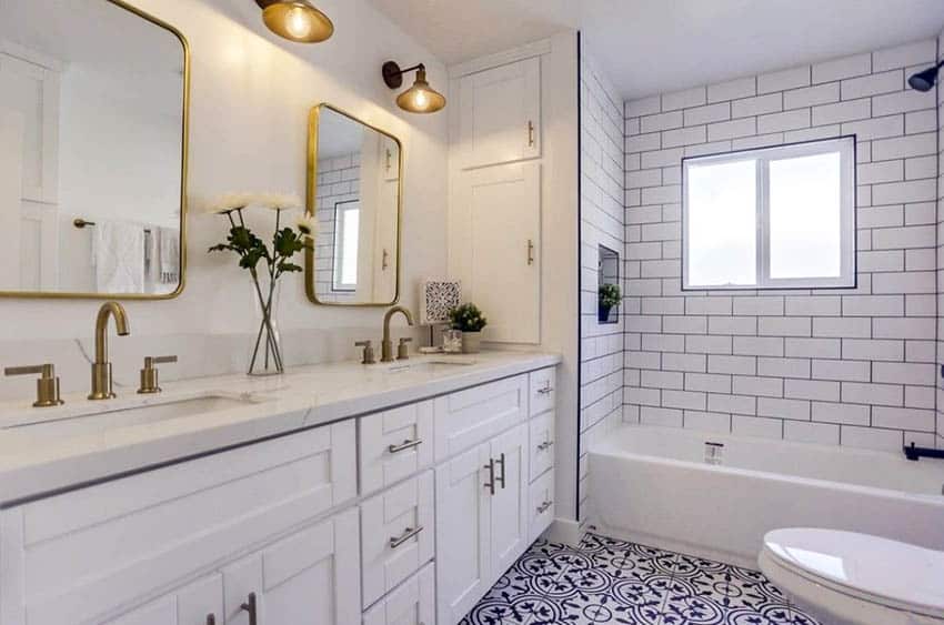 Bathroom with spanish ceramic floor tile and white subway tile shower