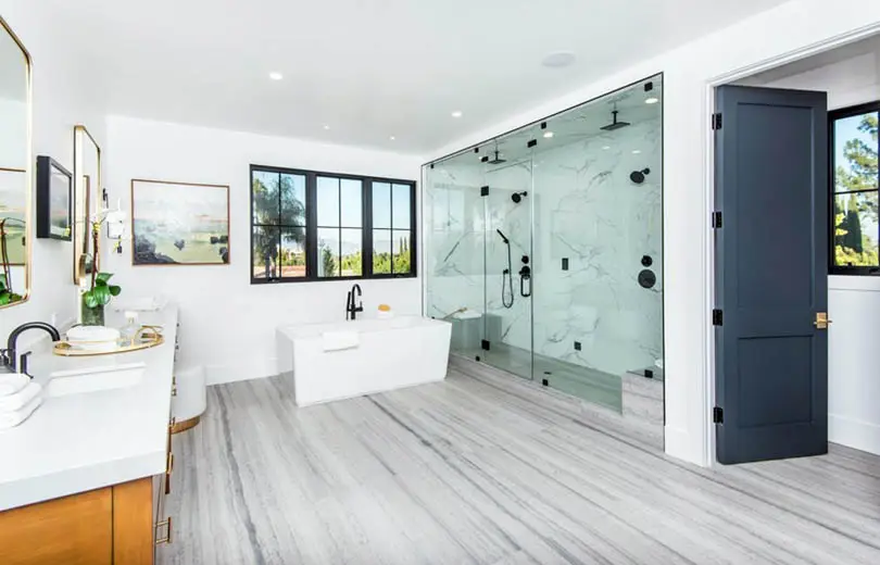 Bathroom with vinyl sheet flooring and large marble shower
