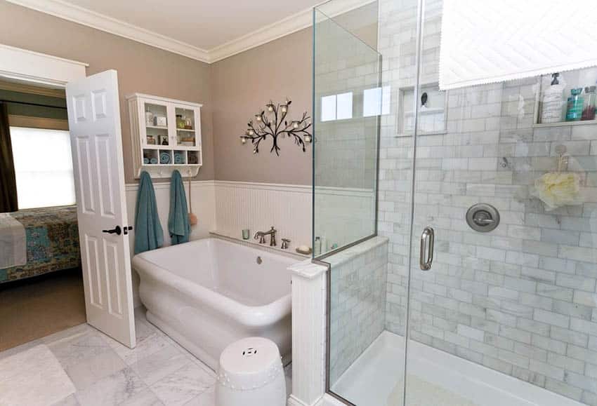 Bathroom with cladding around tub