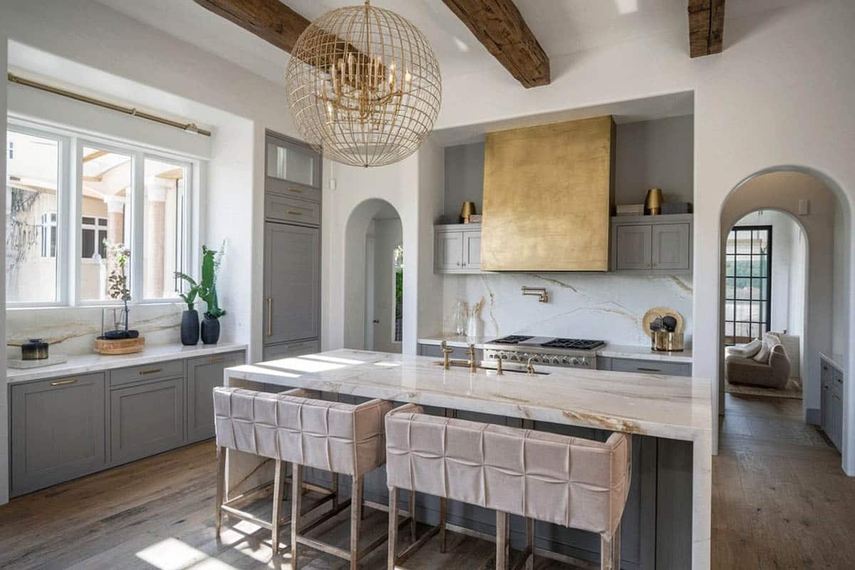 Gray and gorgeous calacatta lasa marble countertops paired with gray on the cabinets