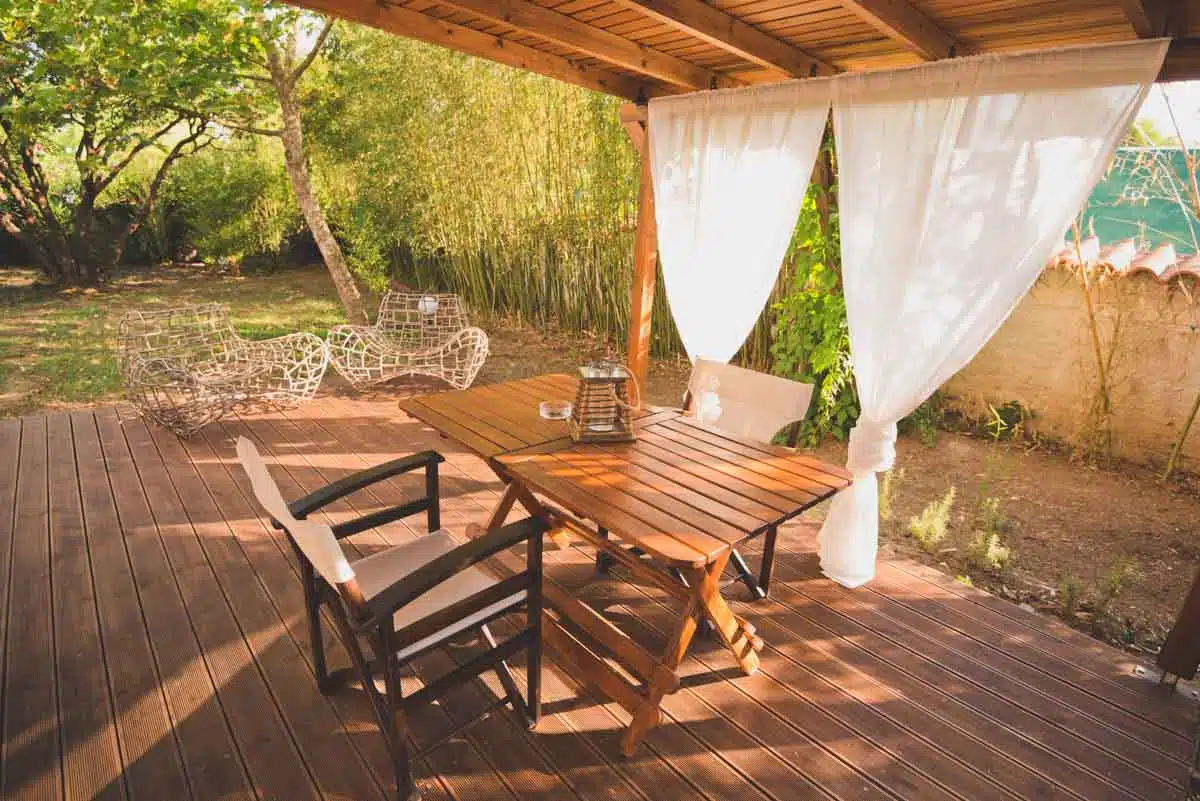 composite patio with wooden chair and table