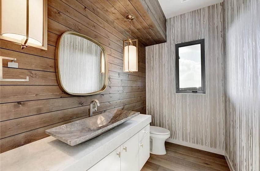 Guest bathroom with wood shiplap accent wall quartz vanity and wallpaper