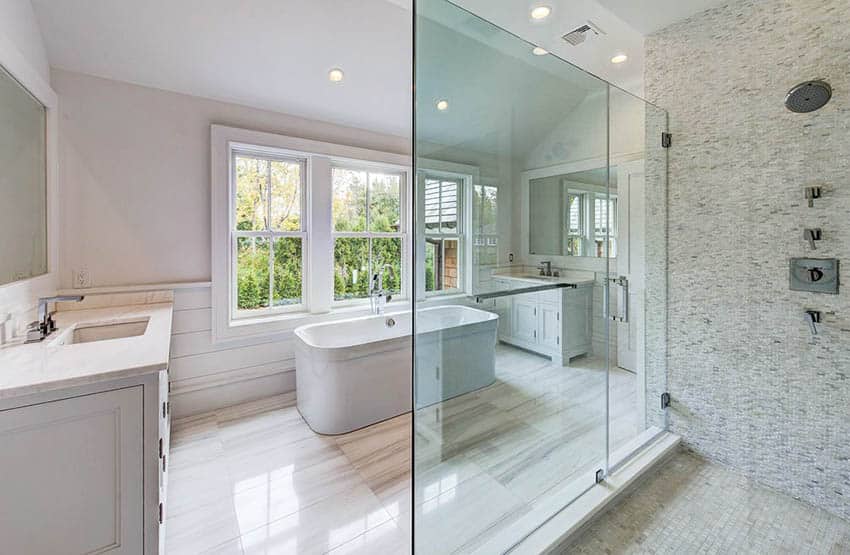 Bathroom with horizontal shiplap, marble floors and tile accent shower