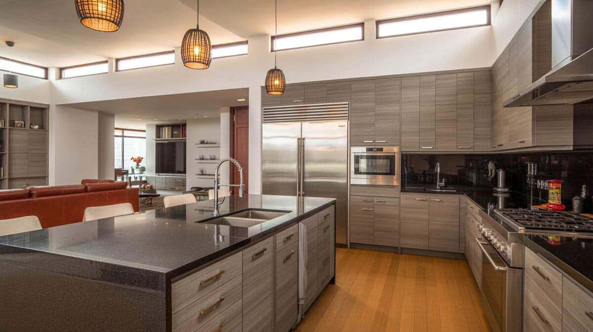Modern interior design kitchen with gray wood grain flat cabinets and dark granite island