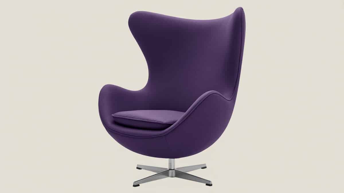 Purple velvet egg chair with high curved shell and chrome swivel