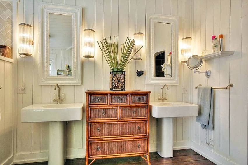 Small bathroom with two pedestal sinks